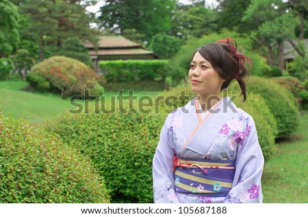 Japanese woman wearing Kimono at Japanese garden