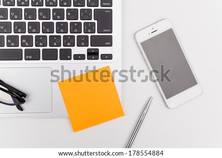 laptop computer and post its