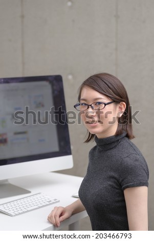 Intelligent woman and desktop computer.