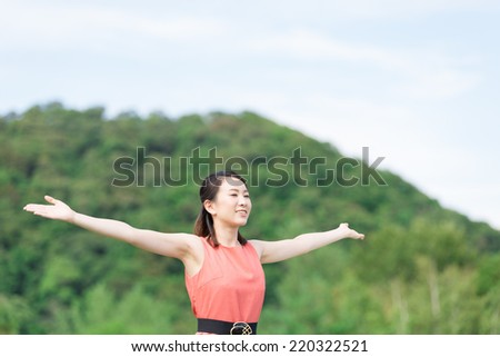 young woman spreading arms.