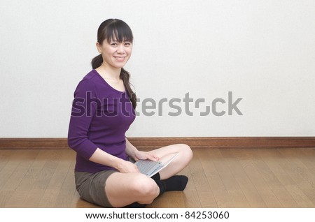 Asian woman with laptop computer
