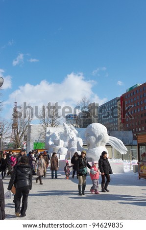 SAPPORO, JAPAN - FEB. 8 : Tourists at Sapporo Snow Festival site on February 8, 2012 in Sapporo, Hokkaido, japan. Sapporo Snow Festival is held annually at Sapporo Odori Park.
