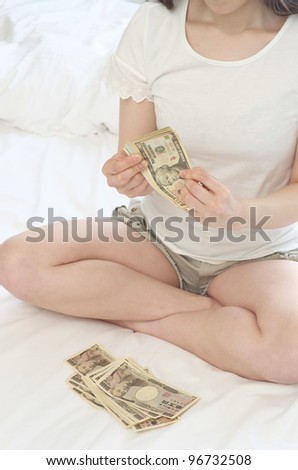Counting Money on the bed