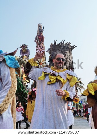 VIAREGGIO, ITALY - MARCH 4 An undefined man in carnival mask at the parades on the promenade during the famous annual Italian Carnival of Viareggio on march 4, 2012 in Viareggio, Italy