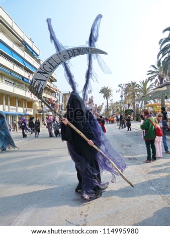 VIAREGGIO, ITALY - MARCH 4 An undefined man in carnival mask at the parades on the promenade during the famous annual Italian Carnival of Viareggio on march 4, 2012\
 in Viareggio, Italy