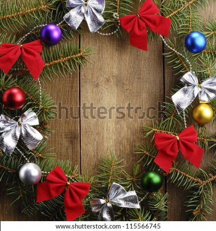 The Christmas Wreath on the wooden background