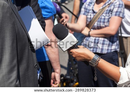 Journalist making interview with businessman