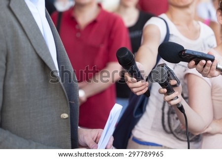 Journalists making interview with businessman or politician