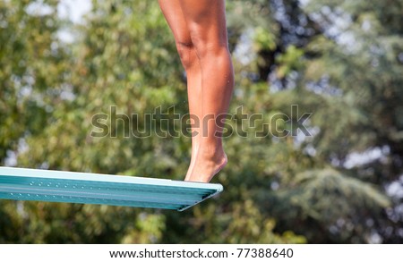 Girl standing on diving board
