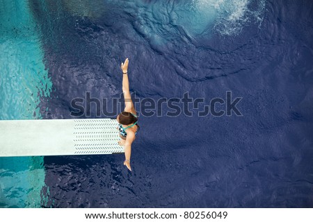 Girl standing on diving board