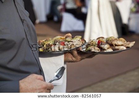 Waitress Carrying Plates