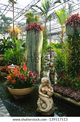 flower and waterfall in indoor garden,Thailand