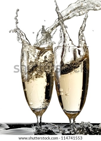 Two champagne glasses splash