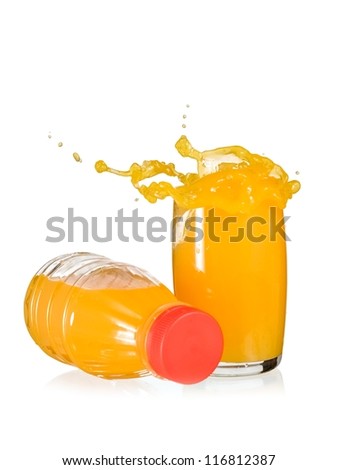 Orange juice splash in a glass and a bottle