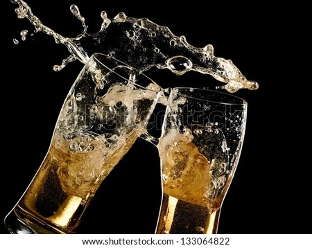Two glasses with beer splash