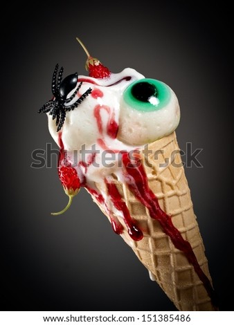 Halloween ice cream with eye and strawberries