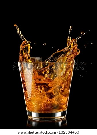 Whiskey splash from a glass