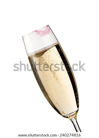 Champagne glass with lipstick print, close up