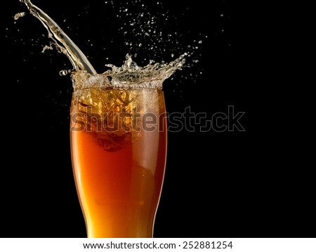Wheat beer pour and splash, close up