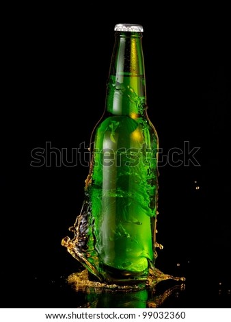 Full green beer bottle splash