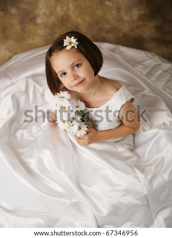  young female child wearing her mother 39s wedding dress which is too big