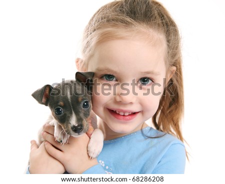 stock photo Portrait of an adorable young girl smiling holding a cute tiny 