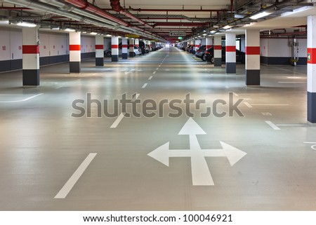 underground parking with road markings and arrows