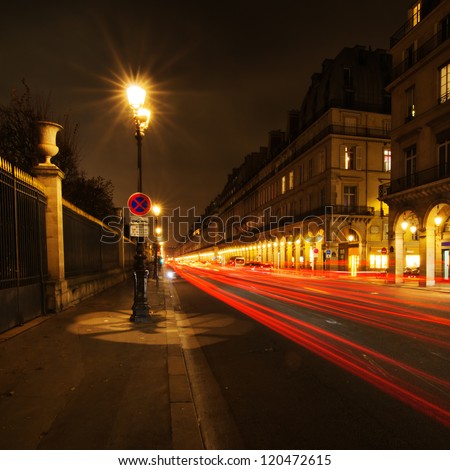 night street of a street in Paris with light trails