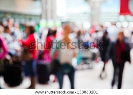people at the airport in abstract out of focus blur