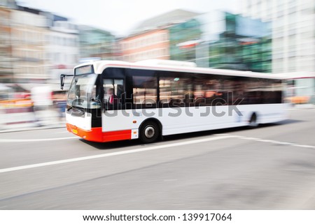 driving bus in city traffic in motion blur