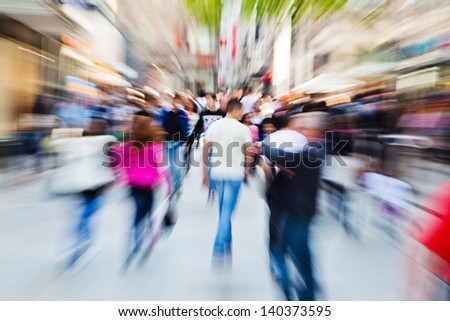 picture of moving people in the pedestrian area of the city with zoom effect