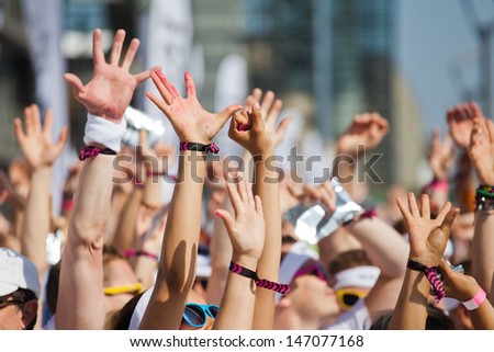 Crowd Of People Raising Their Hands And Have Fun