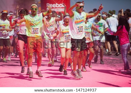 COLOGNE, GERMANY - JULY 23: crowds of unidentified people at the Color Run on July 23, 2013 in Cologne, Germany. The Color Run is a worldwide hosted fun race with about 9000 competitors in Cologne.