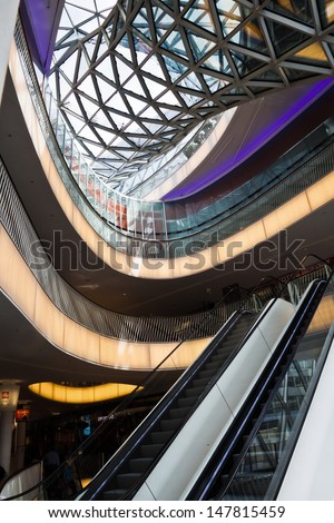FRANKFURT, GERMANY - JUNE 29: inside view of the shopping mall MyZeil on June 29, 2013 in Frankfurt. MyZeil is a famous mall from architect Massimiliano Fuksas with the longest escalator in Germany.