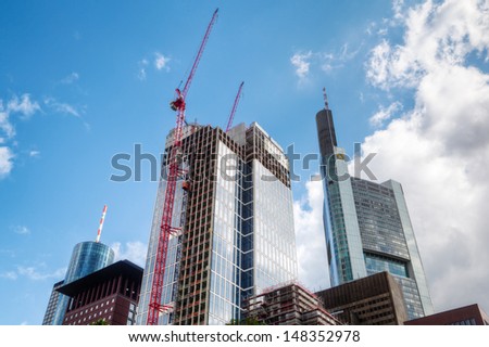 FRANKFURT, GERMANY - JUNE 30: skyscrapers on June 30, 2013 in Frankfurt. In front is the TaunusTower that is currently under construction and planned for 170 Meters and without a fixed renting.
