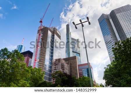FRANKFURT, GERMANY - JUNE 30: skyscrapers on June 30, 2013 in Frankfurt. In front is the TaunusTower that is currently under construction and planned for 170 Meters and without a fixed renting.