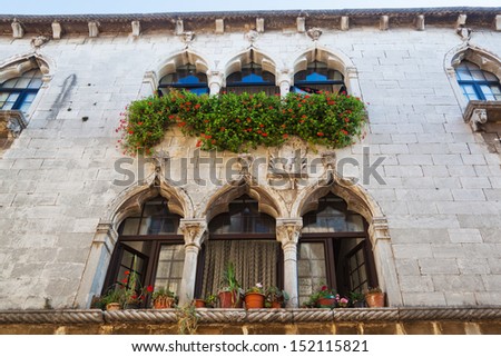venetian style windows at an old house in Porec, Croatia