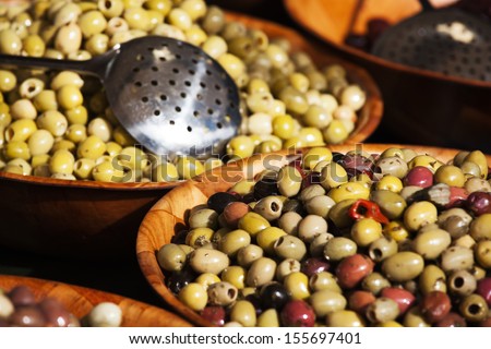 bowls of olives with the focus on the foreground