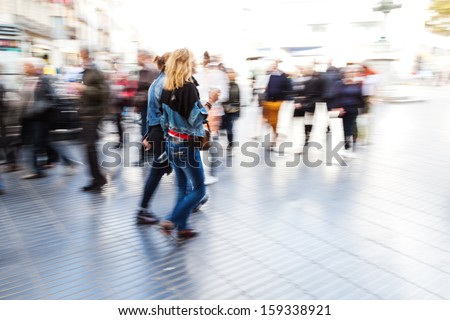 walking people in the city in motion blur