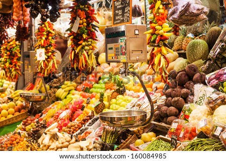 BARCELOLNA, SPAIN - OCTOBER 11: colorful market stand at the market La Boqueria on October 11, 2013 in Barcelona. La Boqueria is a famous market hall in Barcelona on about 2.600 square meters.
