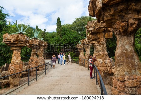 BARCELONA, SPAIN - OCTOBER 12: archway in organic architecture in Park GÃ?Â¼ell with unidentified people on October 12, 2013 in Barcelona. The work of Antoni Gaudi is part of the Unesco world heritage .