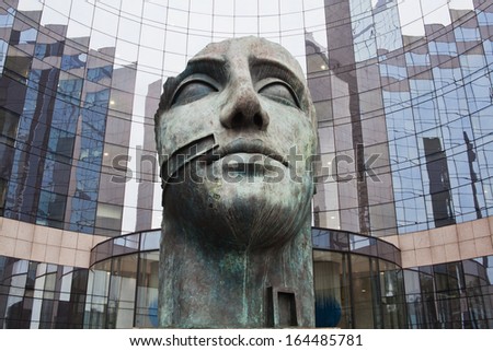 PARIS, FRANCE - NOVEMBER 14: head sculpture in the district La Defense on November 14, 2012 in Paris. The sculpture was created by famous artist Igor Mitoraj.
