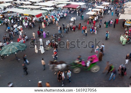MARRAKESH, MOROCCO - NOVEMBER 16: the square Djemaa el Fna with oriental market and unidentified people on November 16, 2013 in Marrakesh. It is part of the UNESCO world heritage.