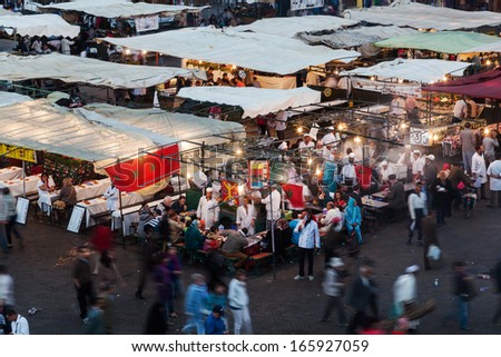 MARRAKESH, MOROCCO - NOVEMBER 16: the square Djemaa el Fna with oriental market and unidentified people on November 16, 2013 in Marrakesh. It is part of the UNESCO world heritage.