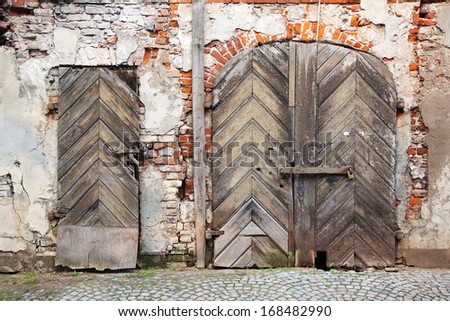 wooden doors in an old run down building