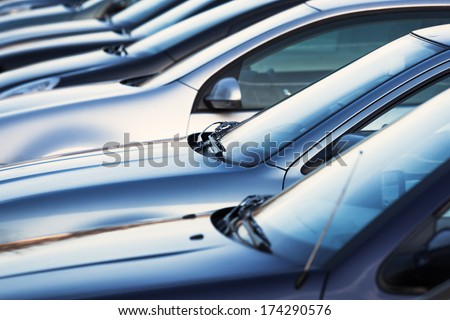 row of cars on a parking lot