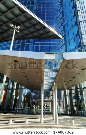 BONN, GERMANY - JANUARY 31: Deutsche Post Tower with unidentified people on January 31, 2014 in Bonn. The Deutsche Post is the world\'s largest courier company.