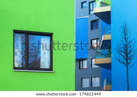 colorful green and blue apartment buildings