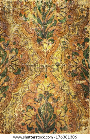 vintage background with old ornamental painting on wood