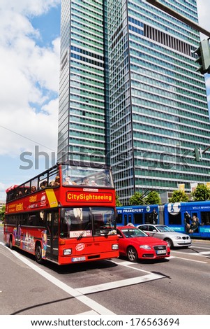 FRANKFURT, GERMANY - JUNE 30: sightseeing bus with unidentified people on June 30, 2013 in Frankfurt. Frankfurt is an important international financial centre and the fifth largest city of Germany.